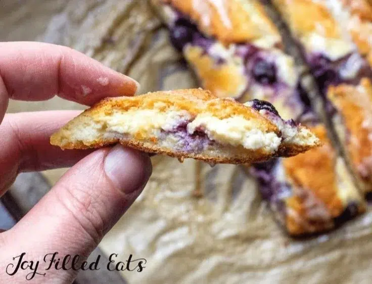 Braided blueberry cream cheese keto danish on a rustic wooden table