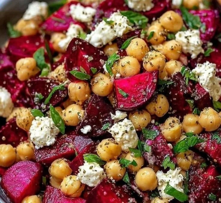 Chickpea, beet, and feta salad in a bowl with fresh ingredients