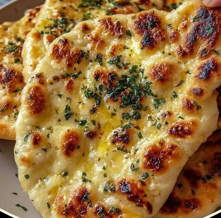 Delicious Cottage Cheese Garlic Skillet Naan served in a skillet.