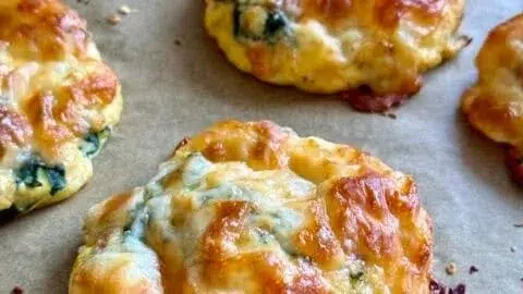 Savory sun dried tomato biscuits with spinach and eggs on a plate