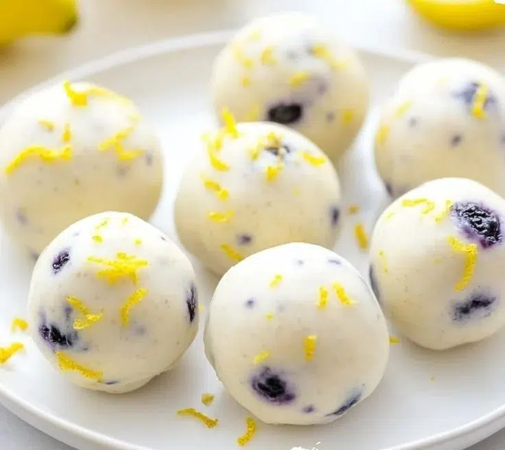 Frosty Lemon Blueberry Protein Bites are a nutritious snack packed with flavor.