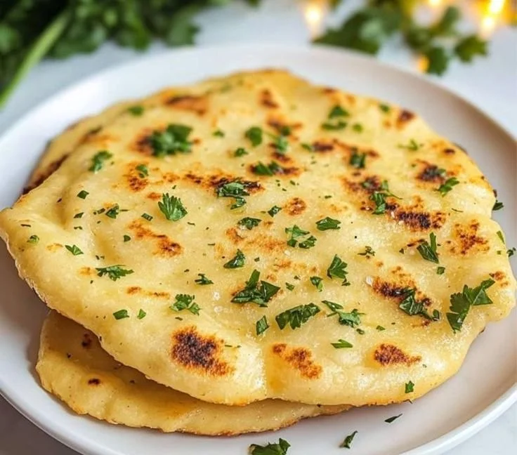Delicious homemade Keto Naan Bread on a wooden table.