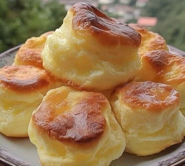 Delicious Nun's Puffs dessert on a plate with powdered sugar