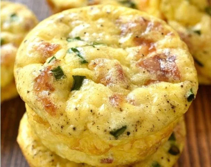Delicious breakfast quiche served on a plate garnished with herbs