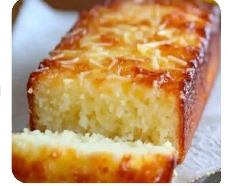 Lemon yogurt cake topped with fresh fruits and mint for a healthy dessert