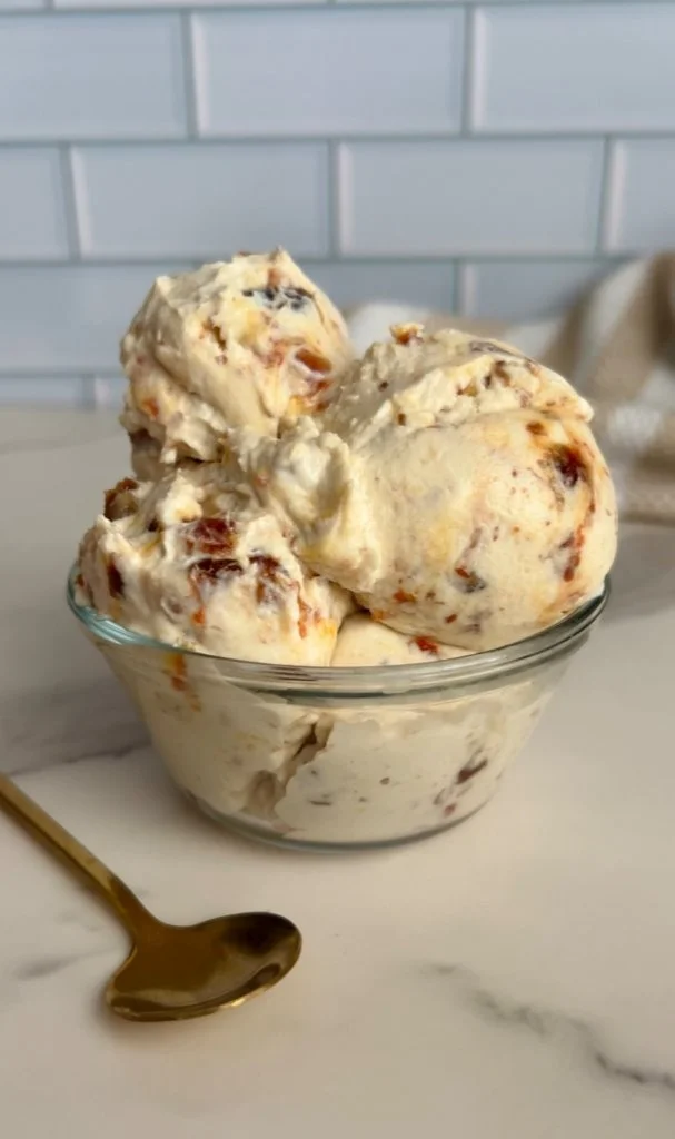 Delicious bowl of salted caramel cottage cheese ice cream topped with caramel drizzle.