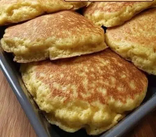 Delicious sweet Mexican pancakes topped with syrup and fresh fruit